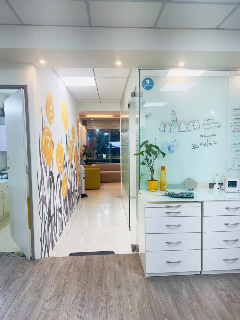 Consultation corridor with flower mural at DENTIN Multispeciality Dental Clinic & Implant Center, HSR Layout Bengaluru