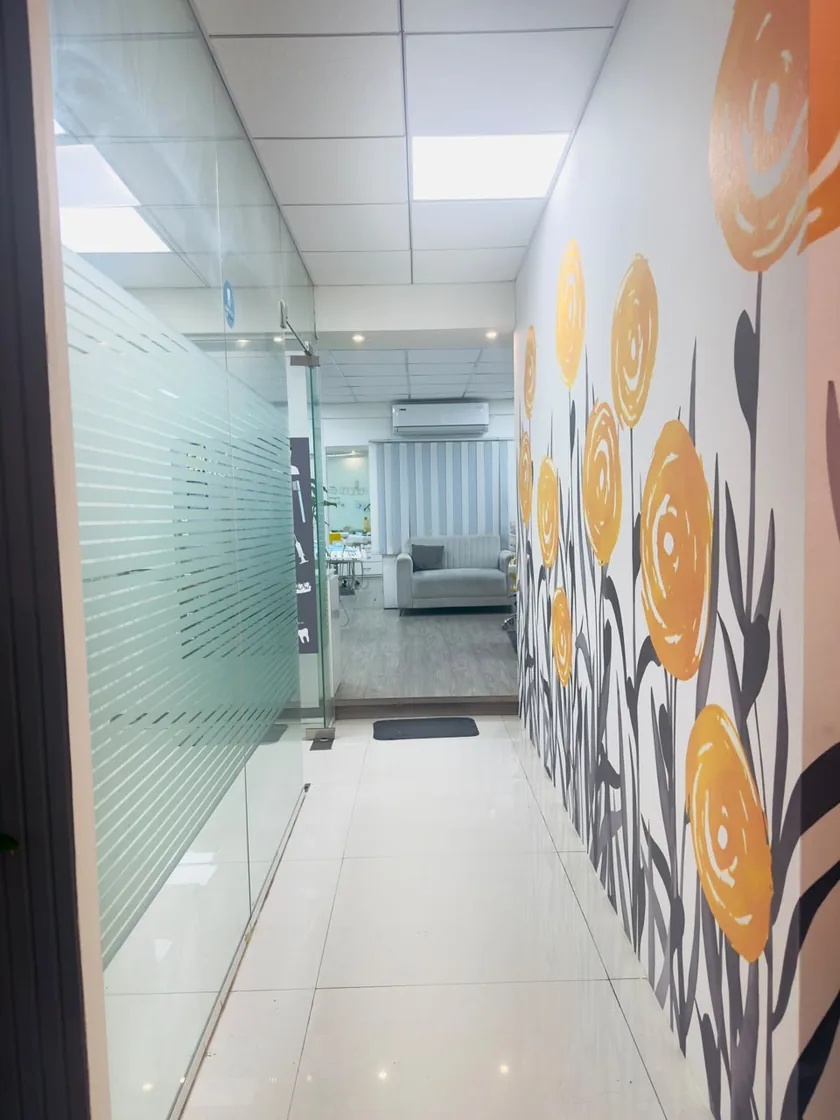 Corridor leading to treatment rooms at DENTIN Multispeciality Dental Clinic & Implant Center, HSR Layout Bengaluru