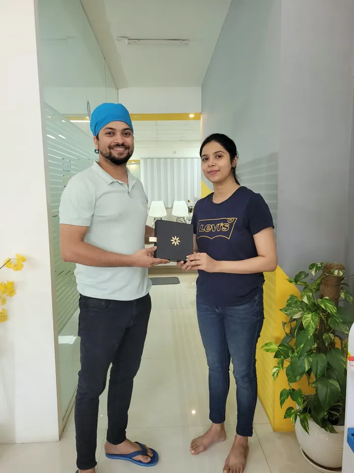 Happy Invisalign patient with Dr. Gaurav at DENTIN