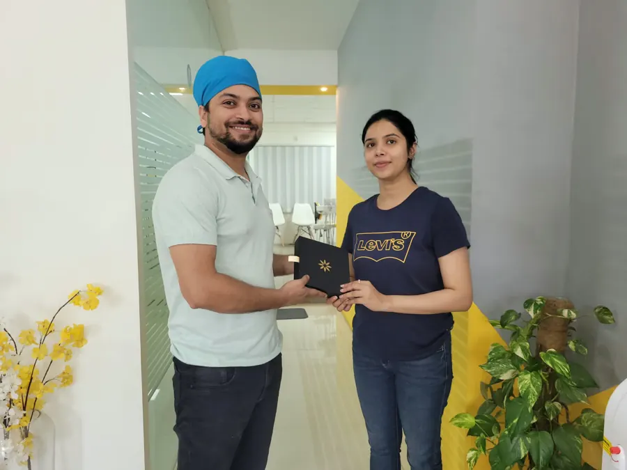 Invisalign patient receiving her aligners at DENTIN